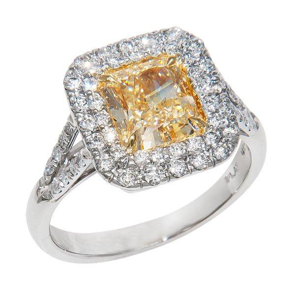 View Natural Fancy Light Yellow and White Diamond set in a Halo Style with Platinum and 18k